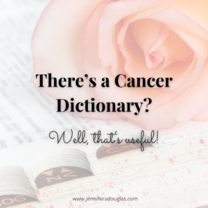 Rose on top of book, text reads: There's a Cancer Dictionary?